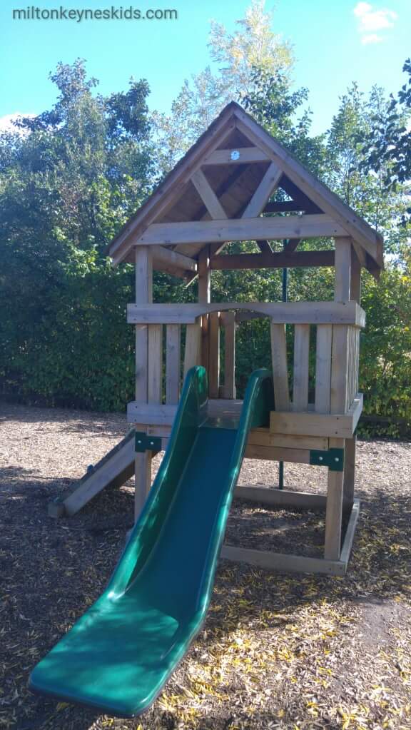 wooden climbing frame with slide at Millennium Country Park