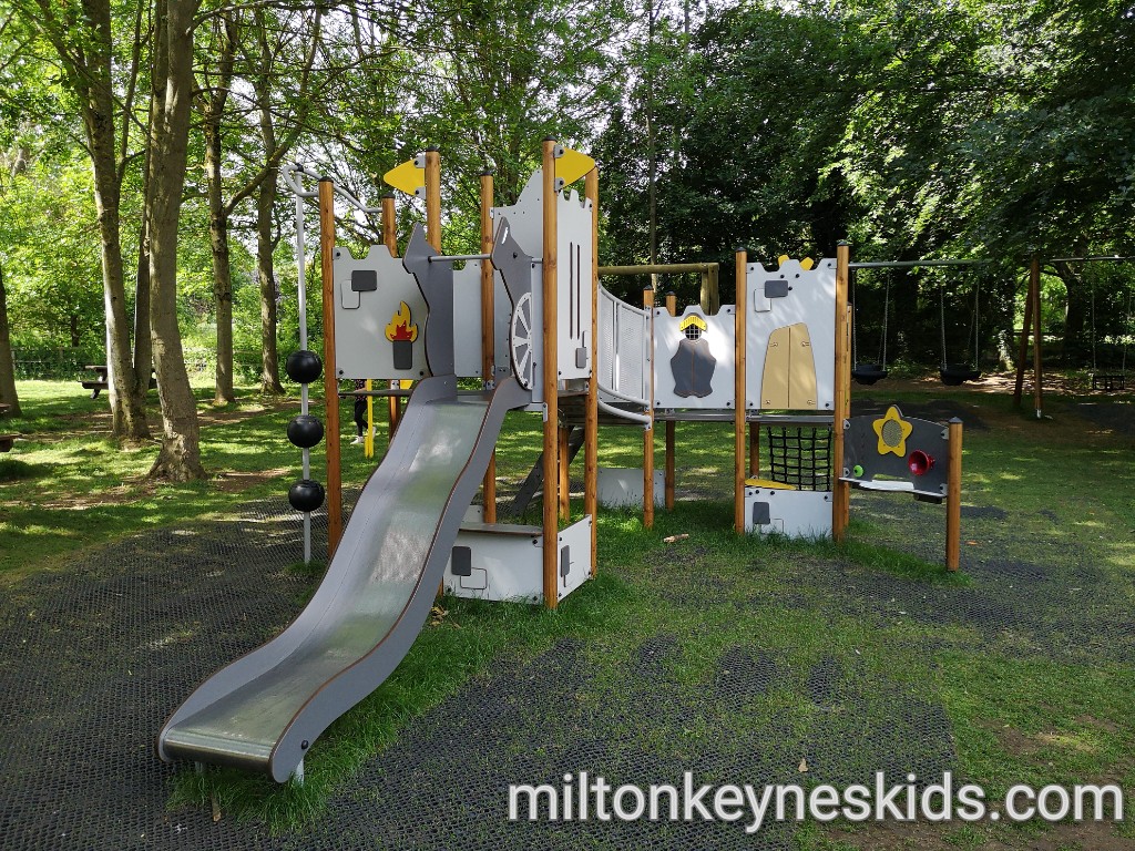 Toddler climbing frame with wavy slide in the play area at Daventry Country Park