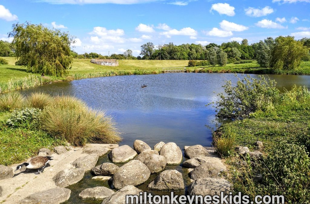 Ashland Lakes In Milton Keynes with stones in front