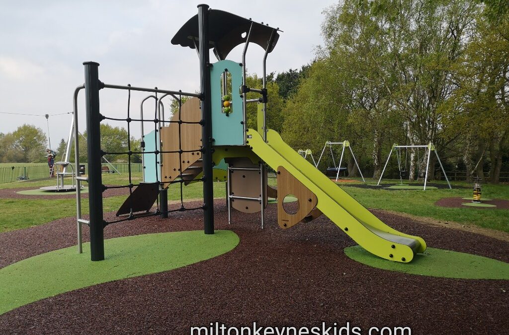 Small climbing frame with green slide