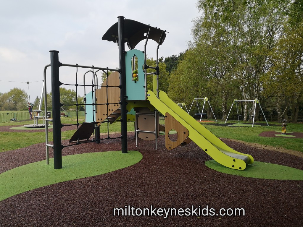 Small climbing frame with green slide