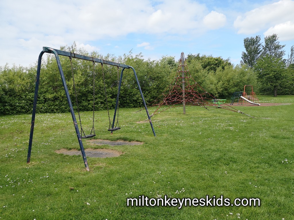 Big swings and red triangle net climbing frame